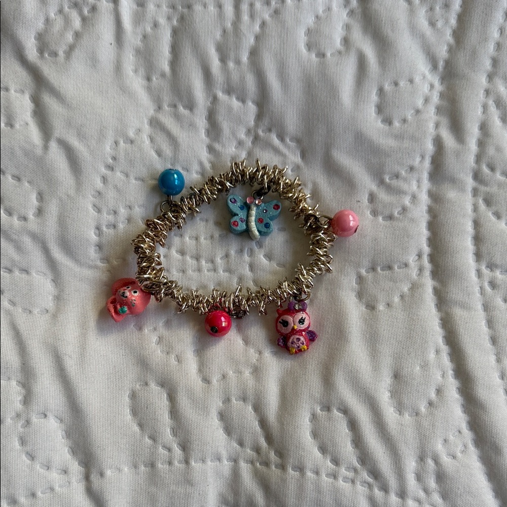 Claire's Gold Charm Bracelet with Pink and Blue Accents